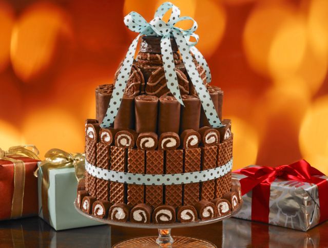 A chocolate cake with a bow on top of it