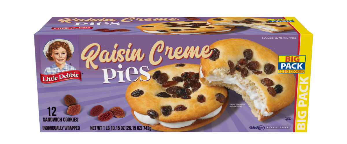 A box of raisin creme pies with raisins and whipped cream