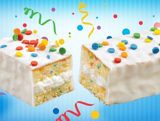 Two pieces of cake with sprinkles on them on a blue background