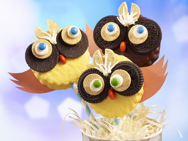 banana marshmallow creme pies decorated to look like owls with chocolate cookies and whimsical eyes