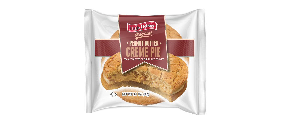 A package of creme pie with a bite taken out of it.