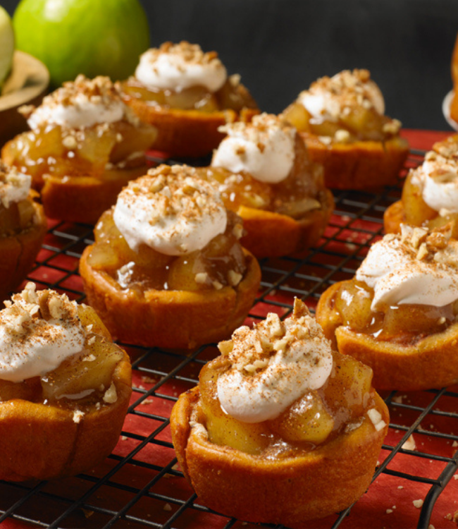 pecan spinwheels topped with apple pie filling and whipped cream