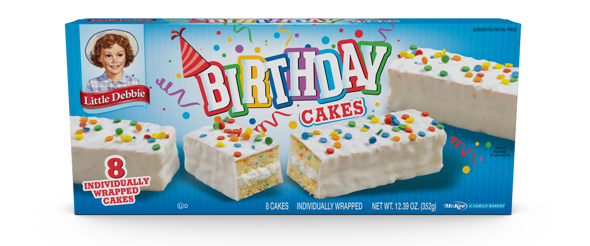 A box of birthday cakes with sprinkles on them