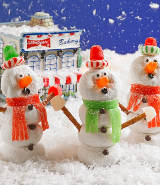 powdered mini donuts decorated as caroling snowmen