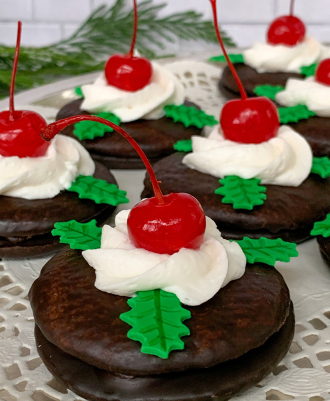 christmas cherry cordials topped with whipped cream and maraschino cherries 