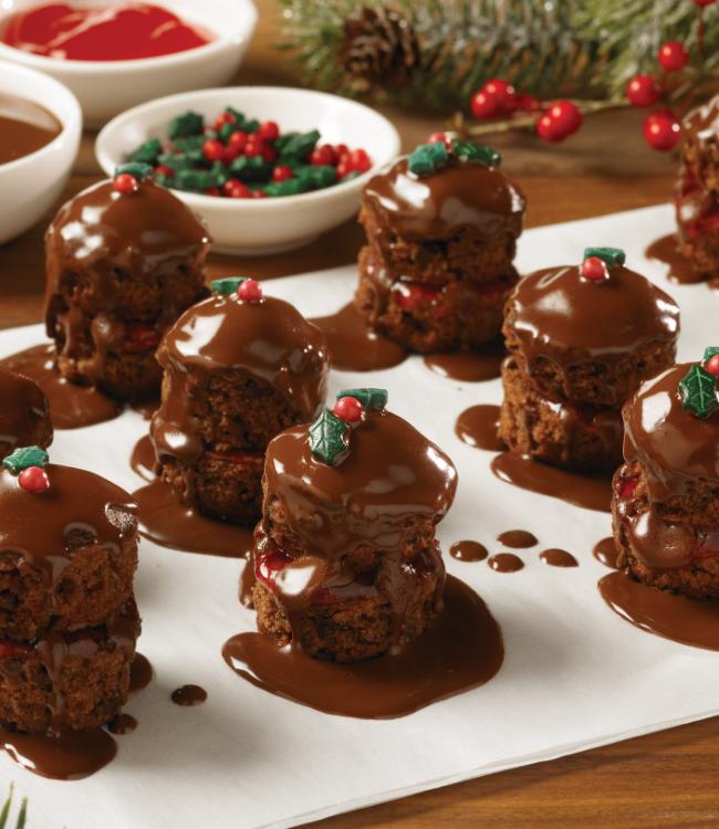 cosmic mini muffins with chocolate sauce and sprinkles on top