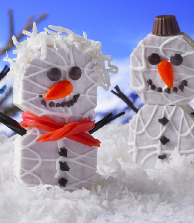 fancy cakes decorated as snowmen