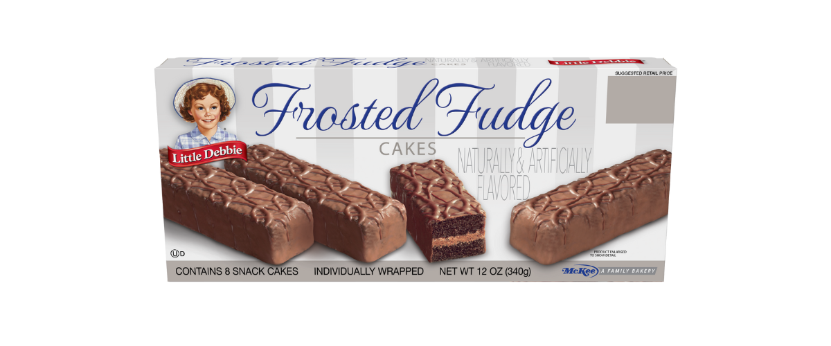 A box of frosted fudge cakes on a white background.