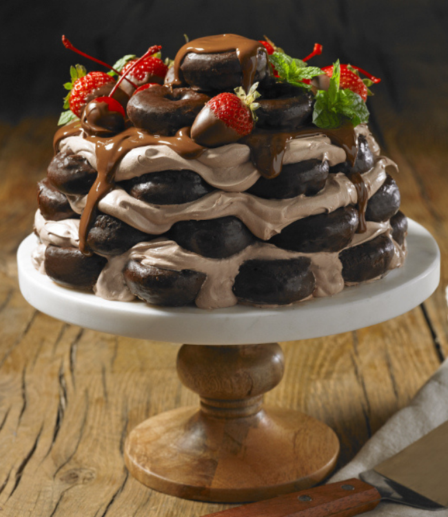 fudge round donuts layered as a cake with frosting