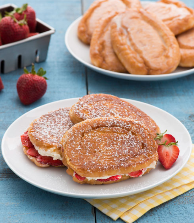 honey bun french toast with strawberries and whipped cream