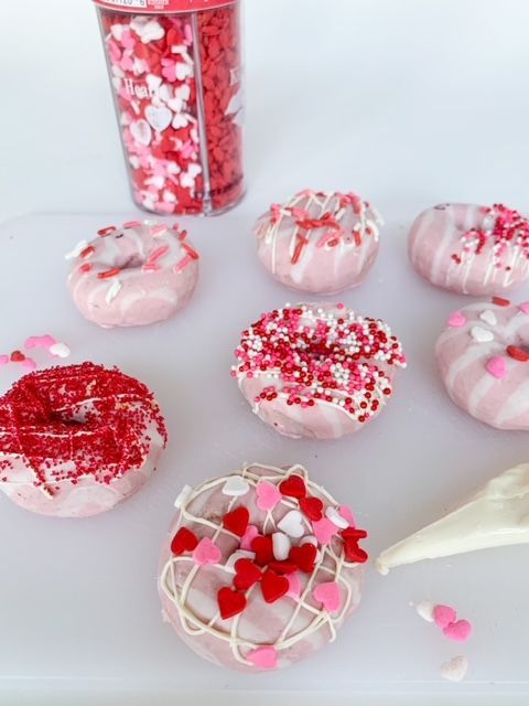 valentine mini donuts decorated with red, white and pink sprinkles