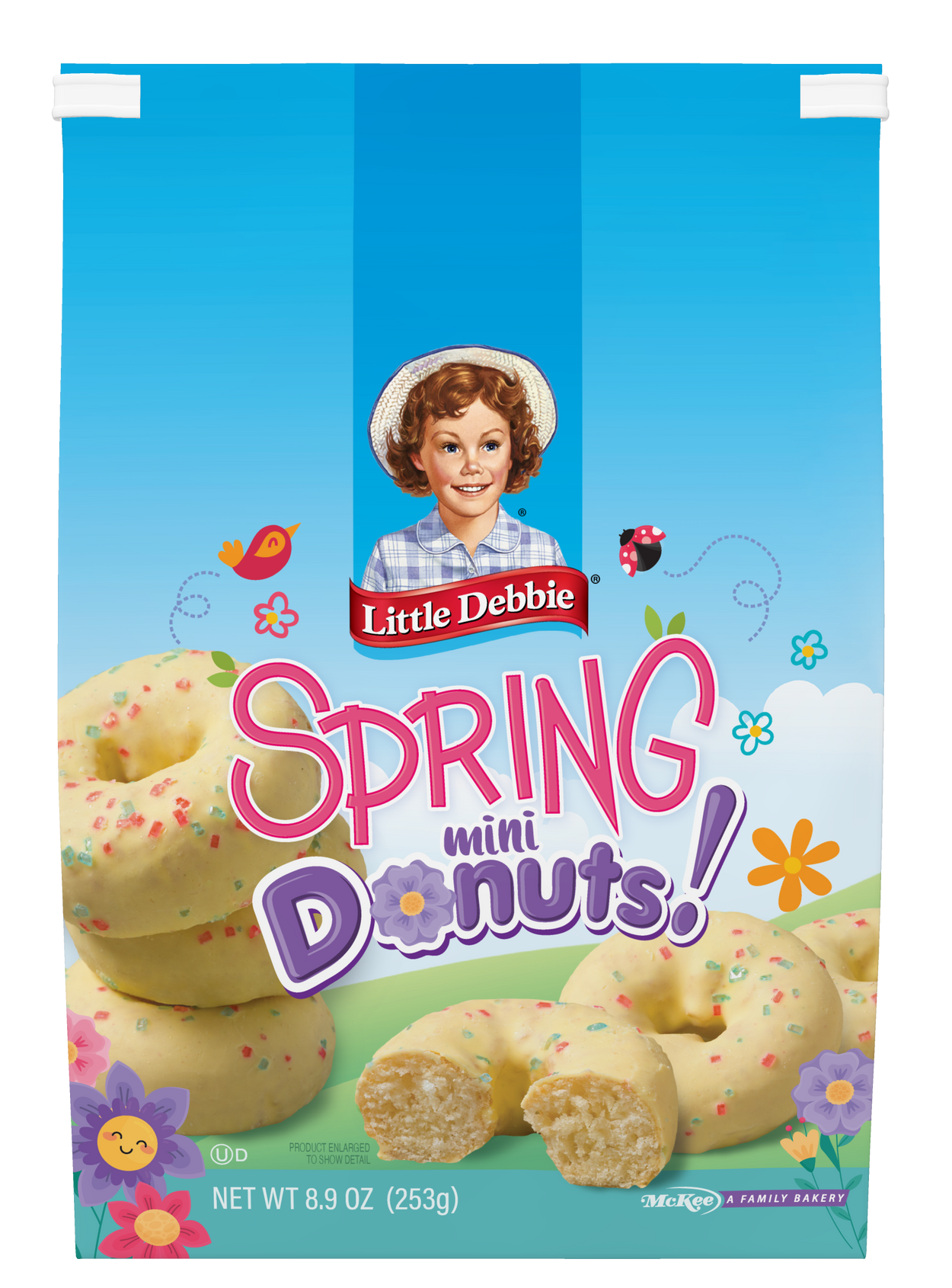 A bag of spring mini donuts with sprinkles on them