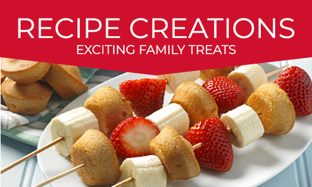 A white plate topped with bananas and strawberries with the words recipe creations exciting family treats