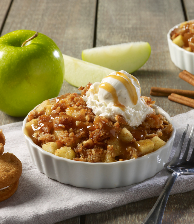 apple cobbler made with snickerdoodle creme pies and topped with ice cream