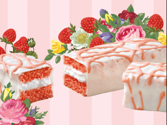 A cake with strawberries and flowers on it