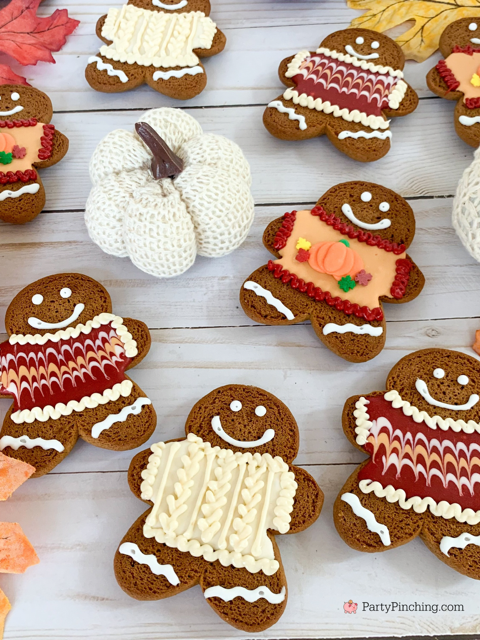 decorated gingerbread cookies in icing sweaters