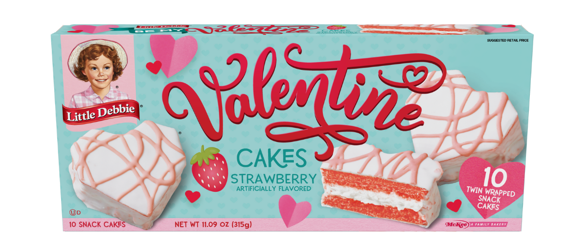 A box of valentine cakes in the shape of a heart.