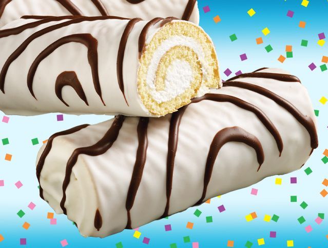 Two white rolls with chocolate stripes are stacked on top of each other