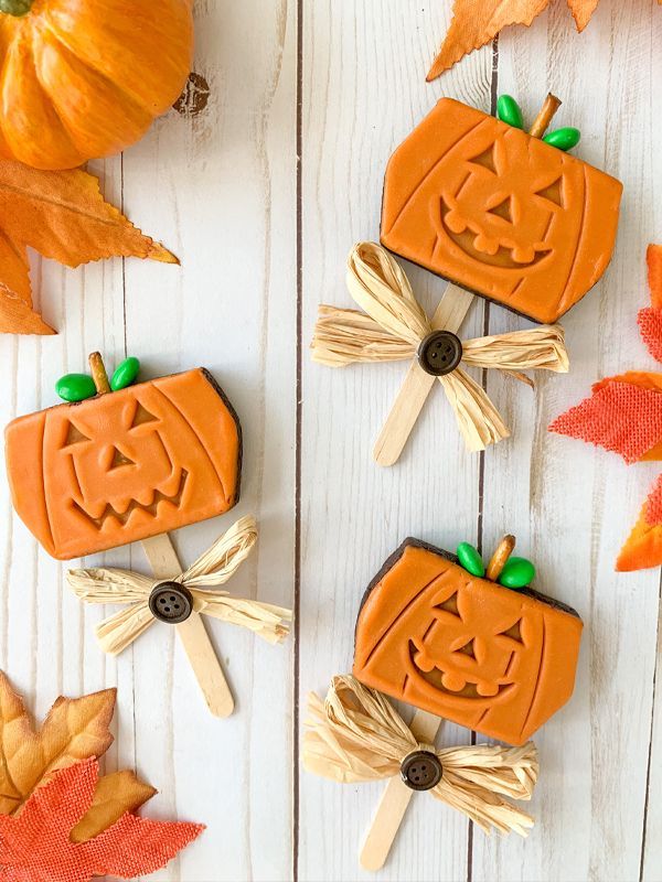 mini pumpkin pies with leaves and pumpkins on top