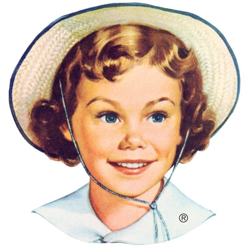 A little girl wearing a straw hat and smiling