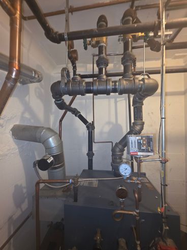 A properly sized and piped out Steam Boiler installed in Long Island NY by Mad Dog Sweeney, Floral Park Plumbing and Heating