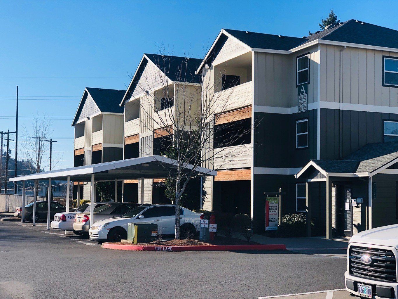 exterior side of building with parked cars
