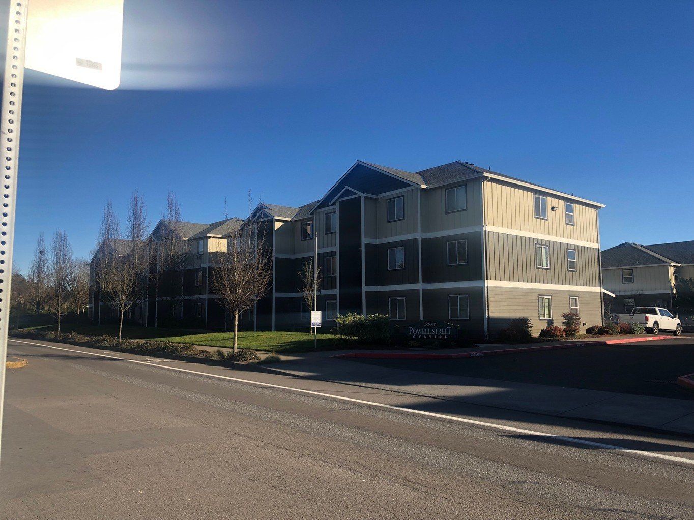 exterior side of building with parked cars