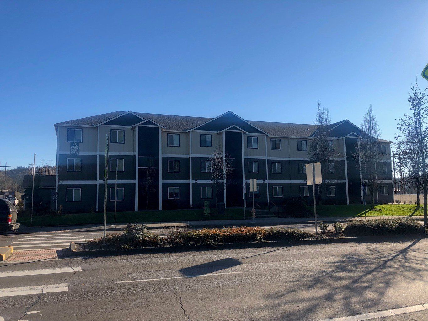 exterior side of building with parked cars