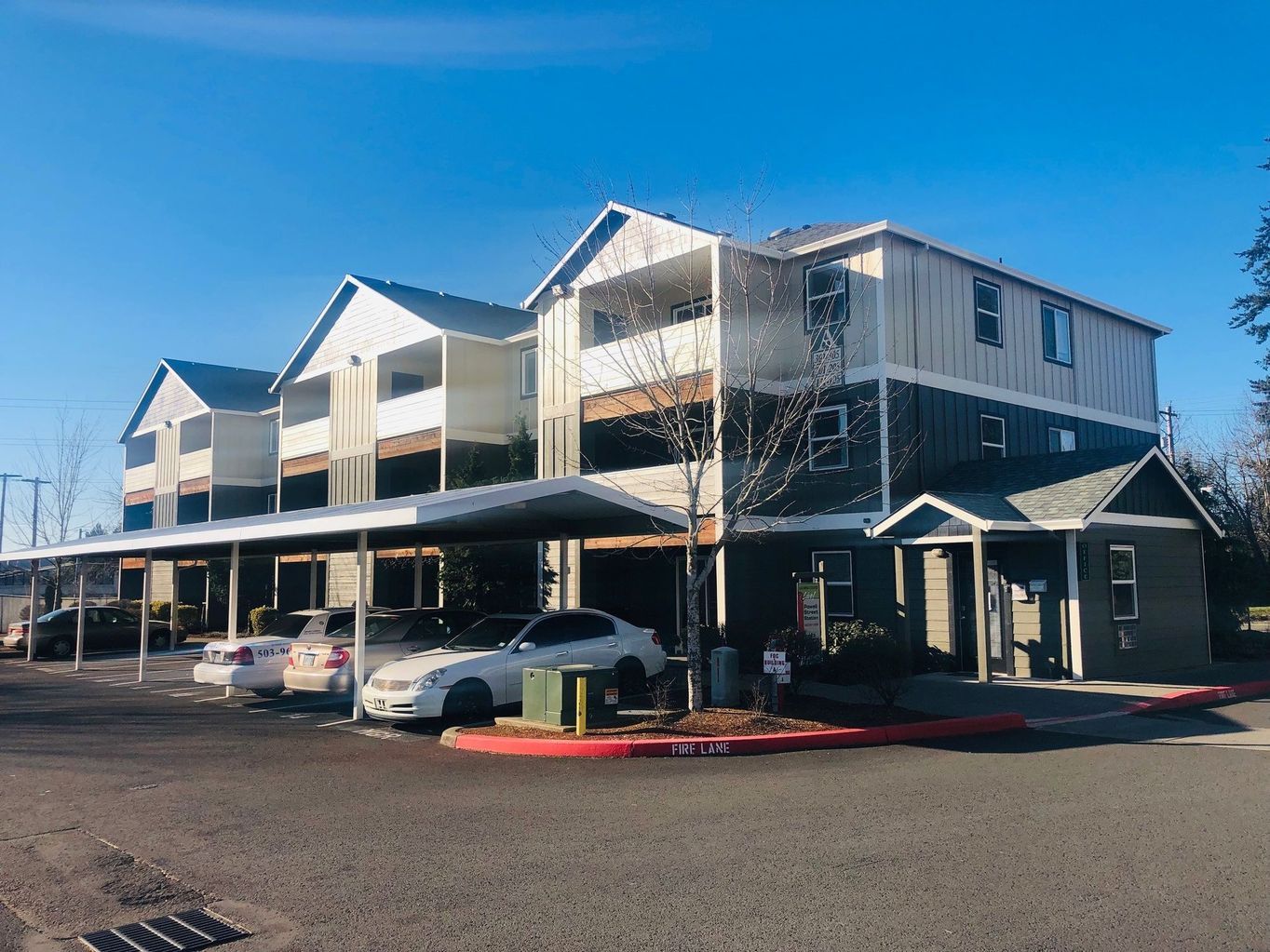 exterior side of building with parked cars