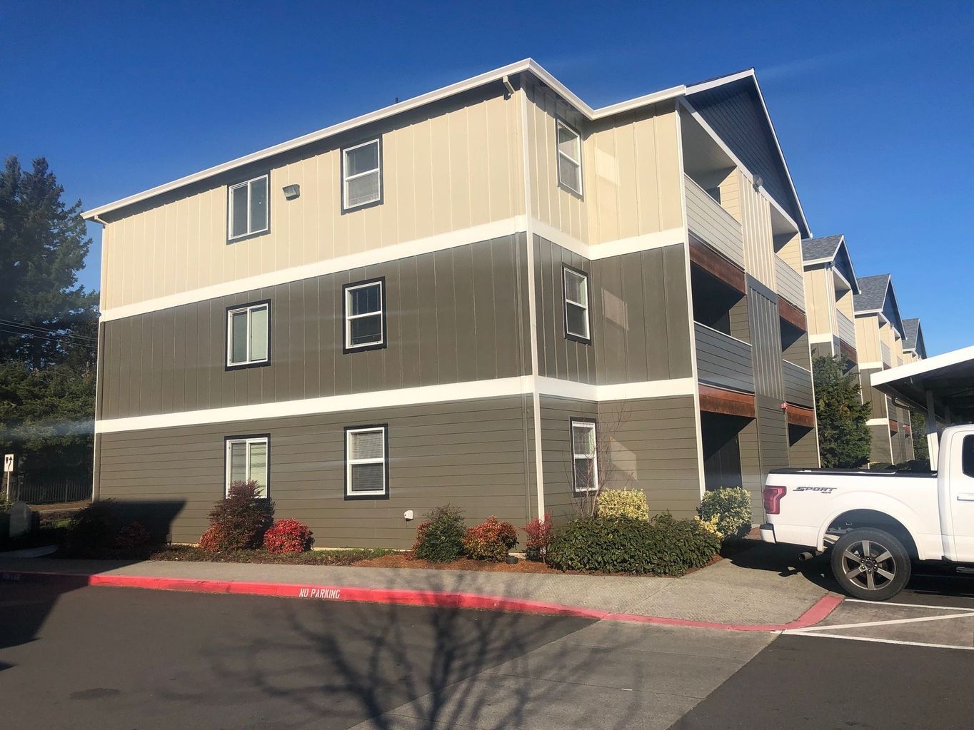 exterior side of building with parked cars
