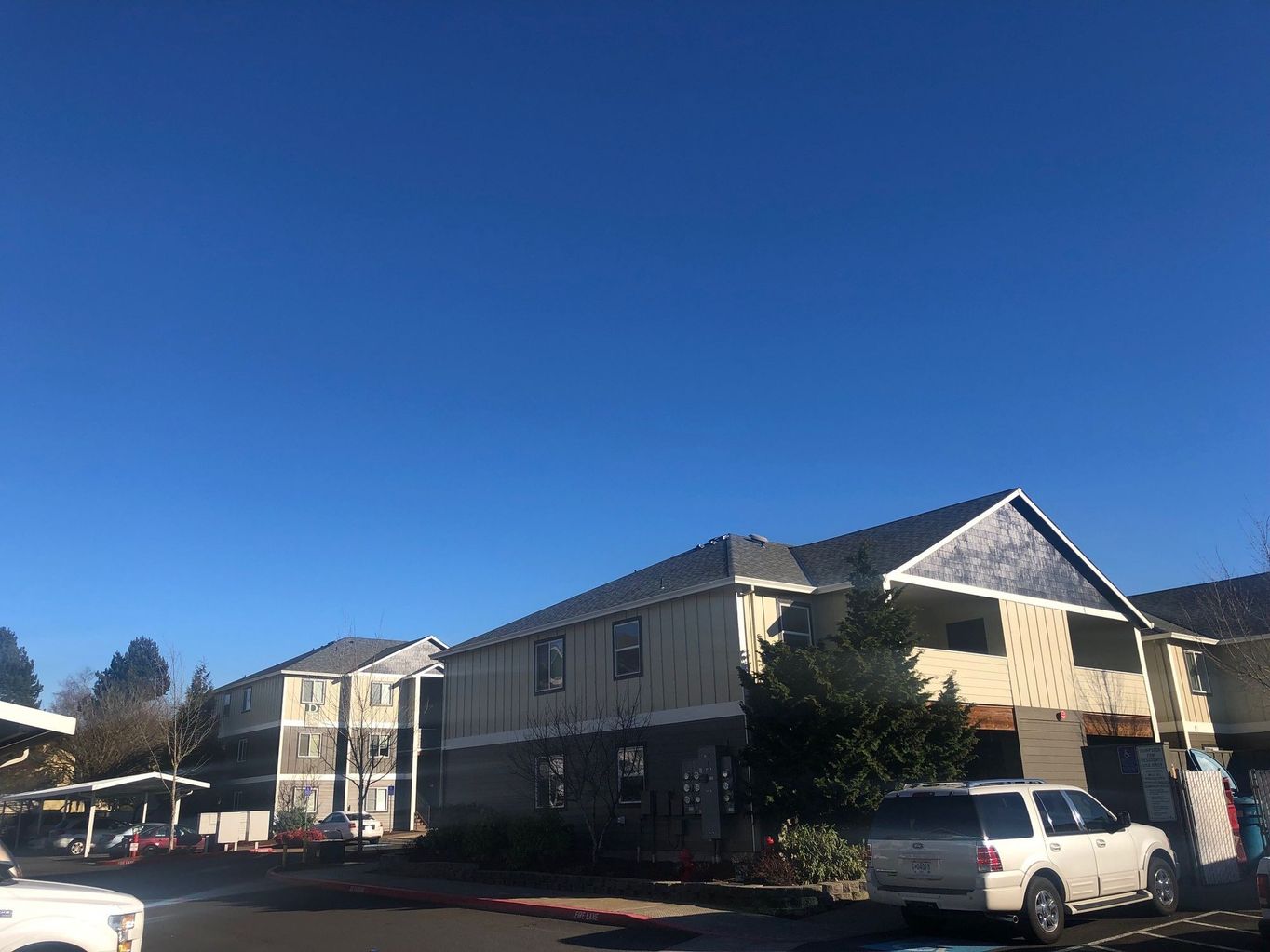 exterior side of building with parked cars