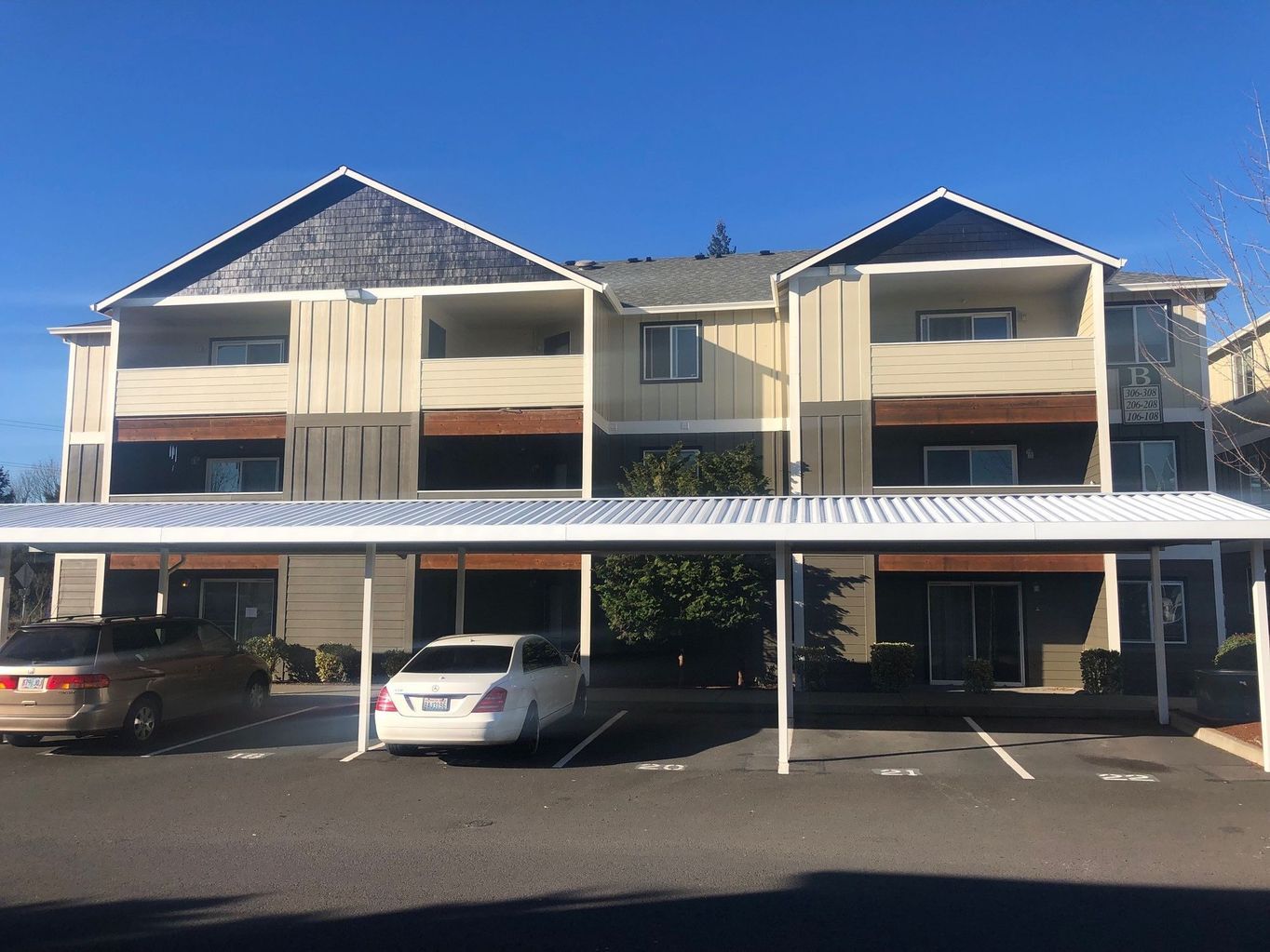 exterior side of building with parked cars