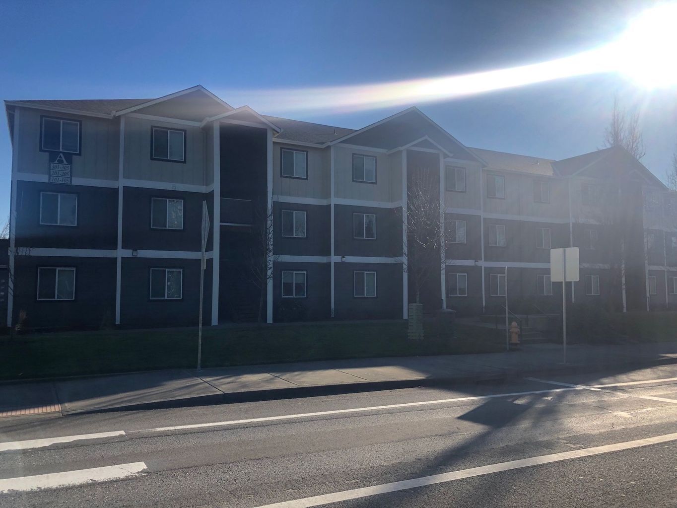 exterior side of building with parked cars