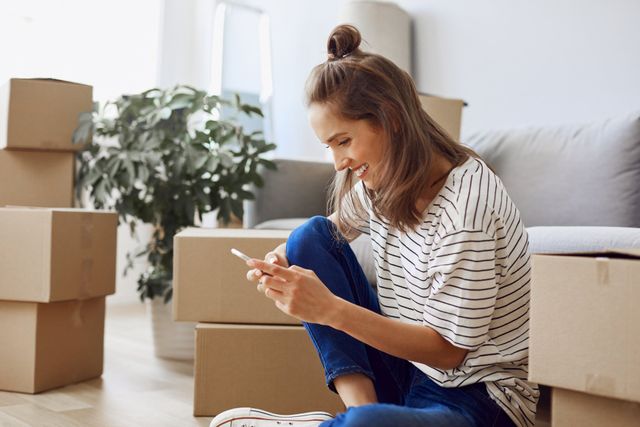 woman moving in and texting