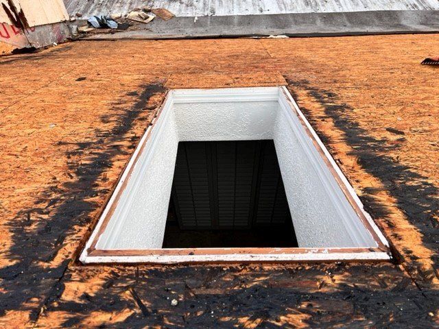 There is a hole in the roof that looks like a tunnel.