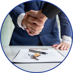 Handshake over a contract with keys, suggesting a real estate deal.