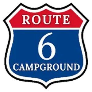 A blue and red route 6 campground sign