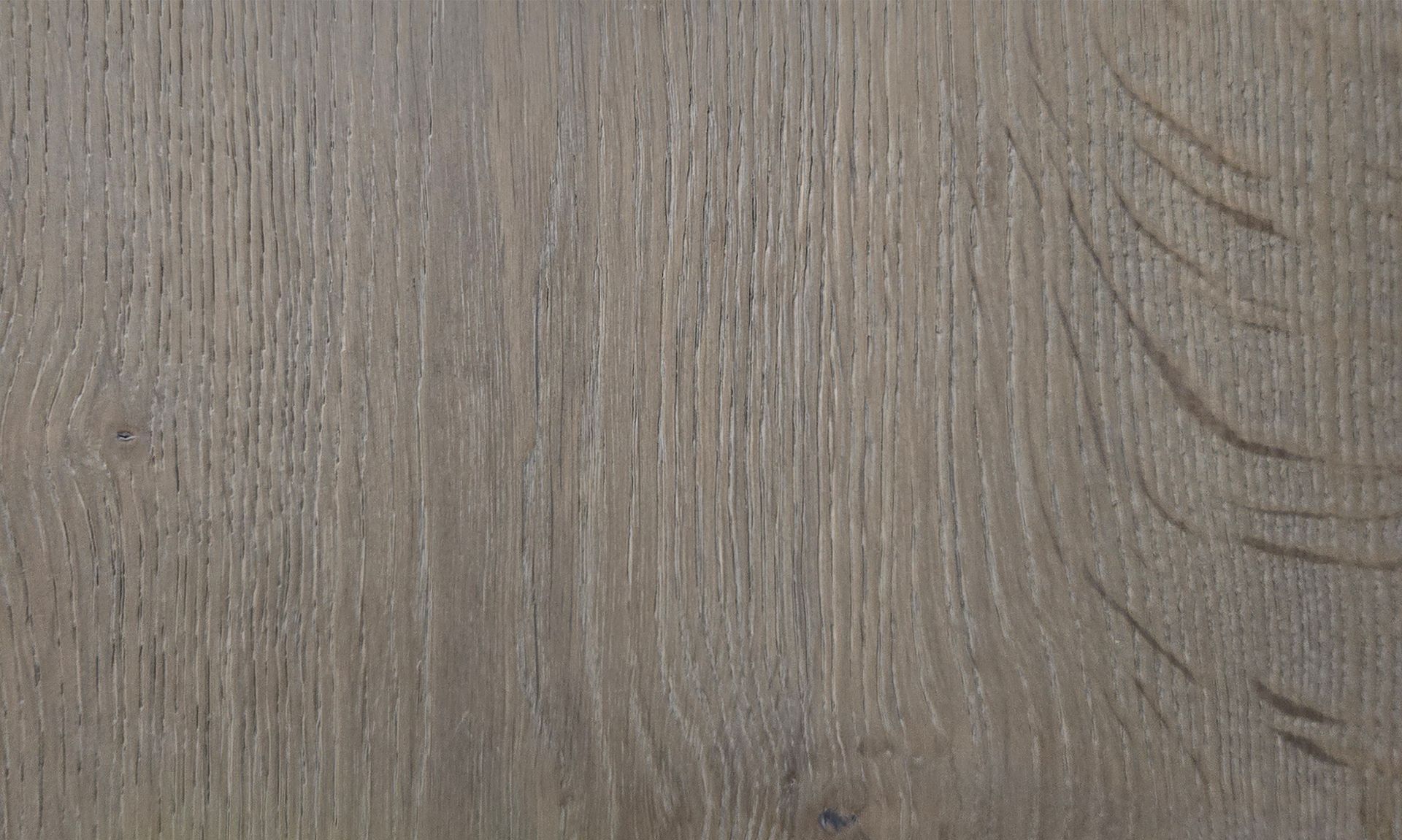 Detalle del piso de madera de ingeniería de la colección Unique en acabado Steel. Se muestra la veta y la textura.