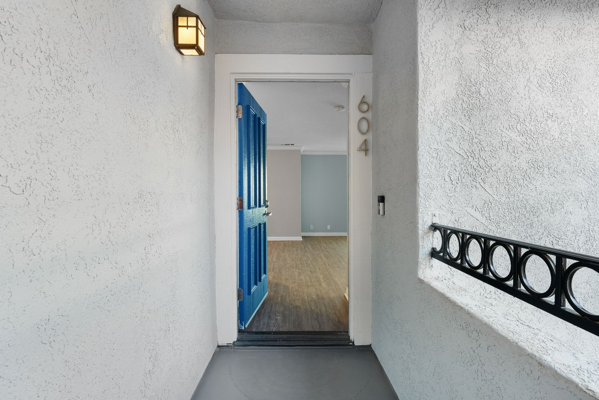 Open front door leading to apartment