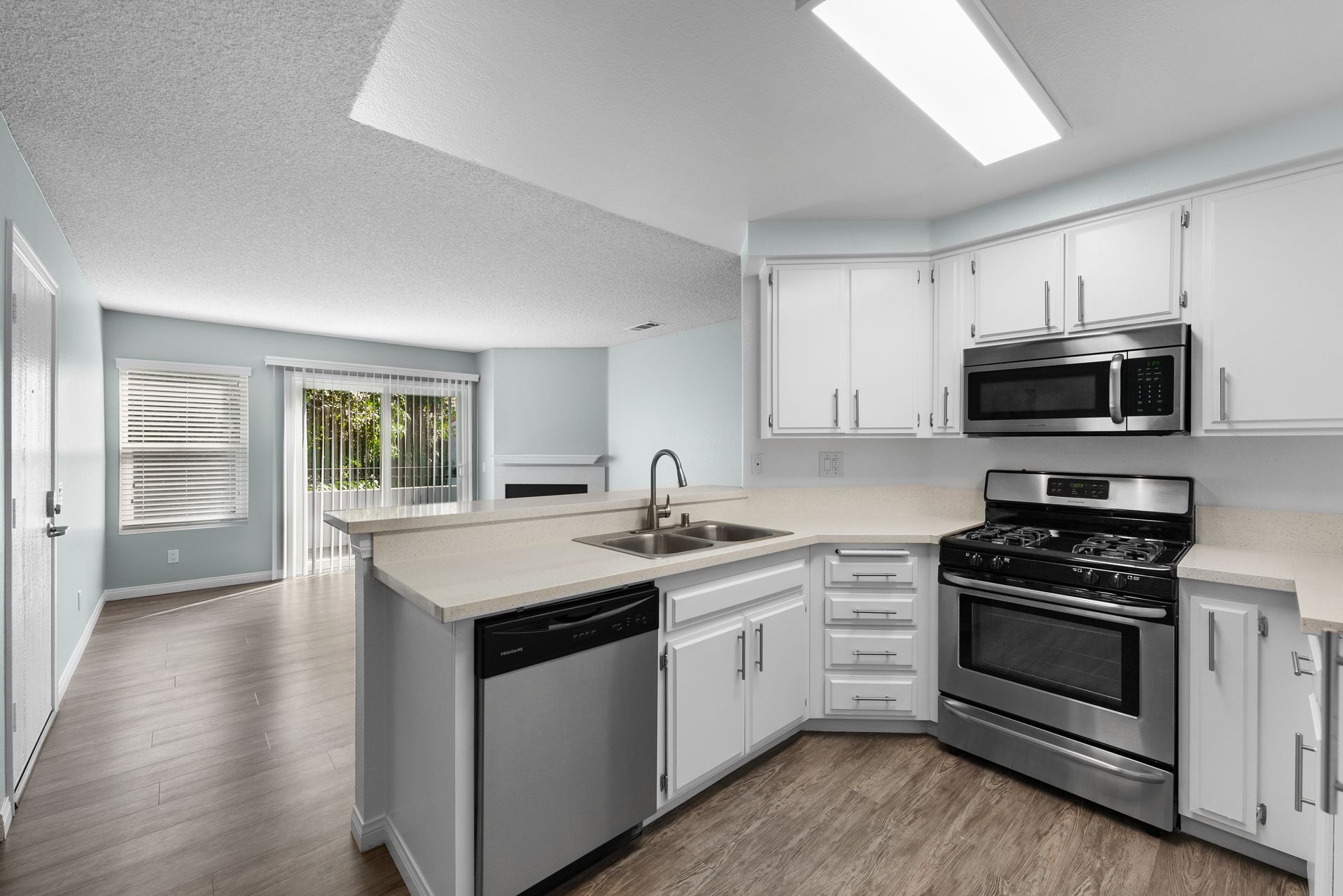 Kitchen with dishwasher, sink, and oven