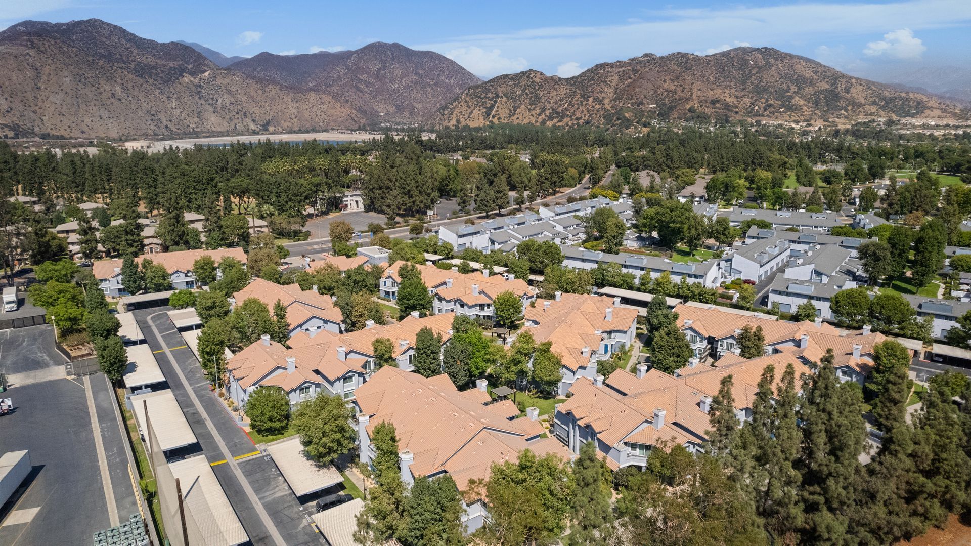 Drone view of apartment community and mountains