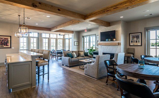 A living room filled with furniture and a fireplace.