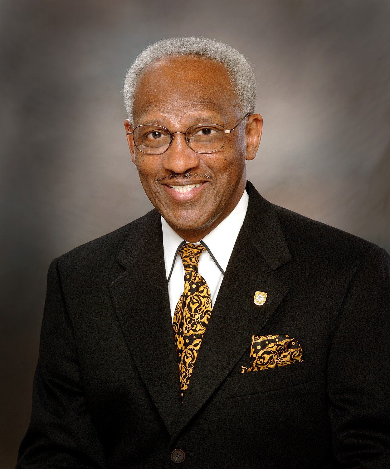 a man in a suit and tie has a Pocket Square