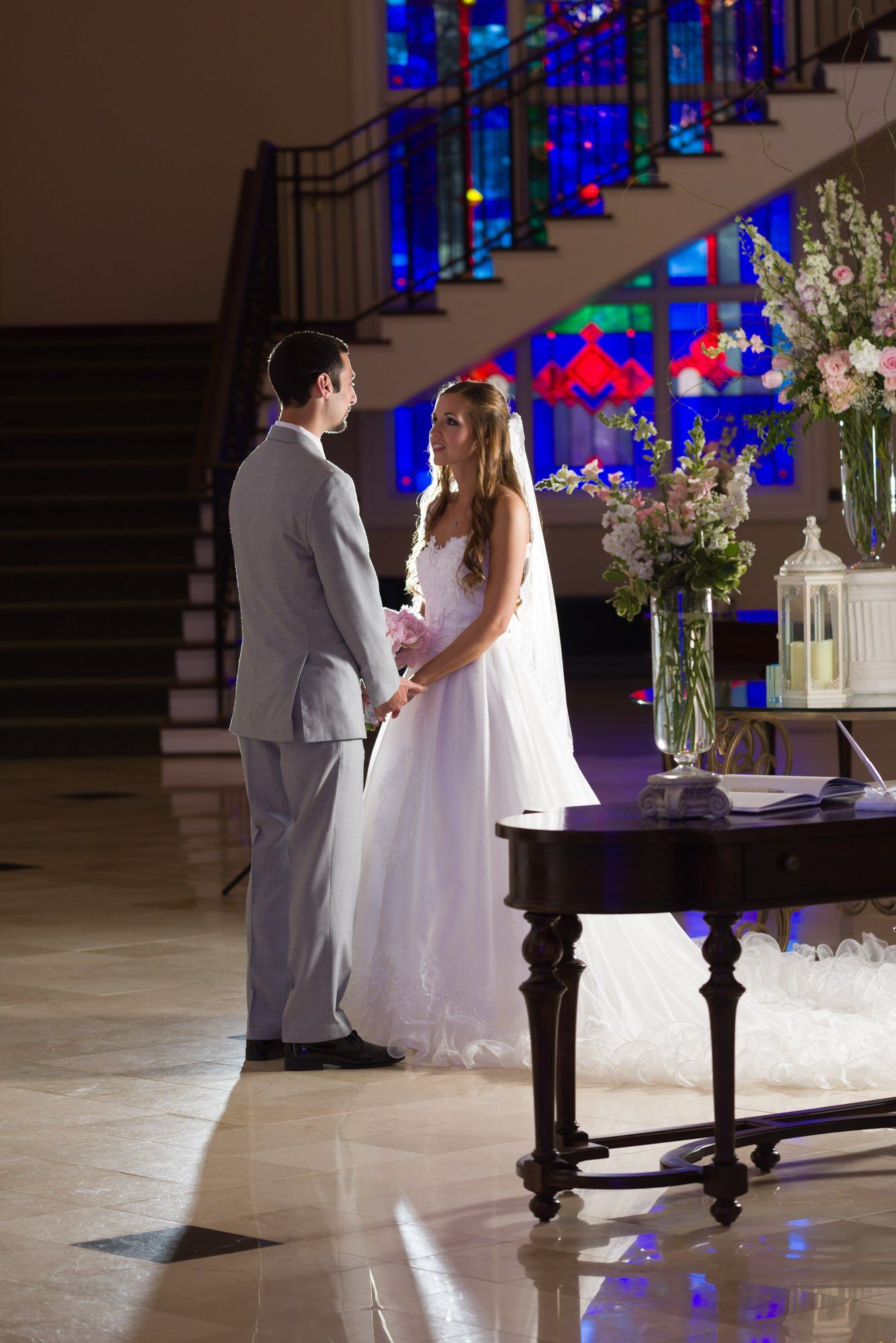 Bride and Groom Indoors with Stained Glass