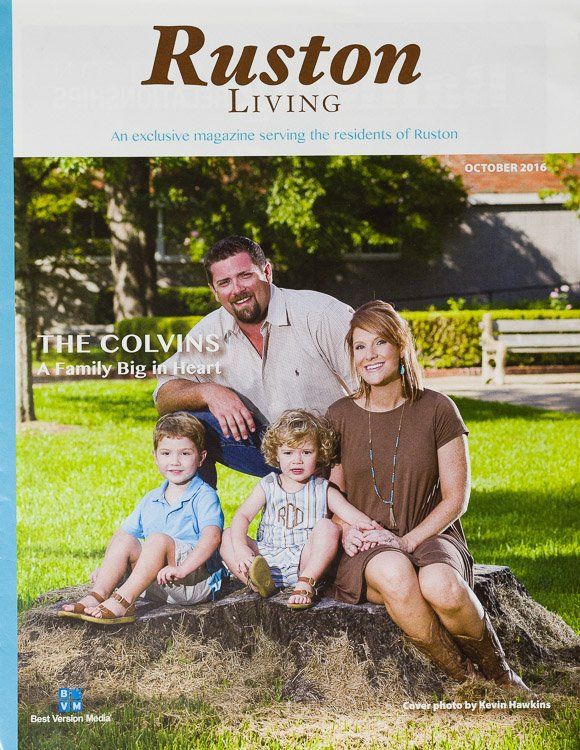 A ruston living magazine shows a family sitting on a rock