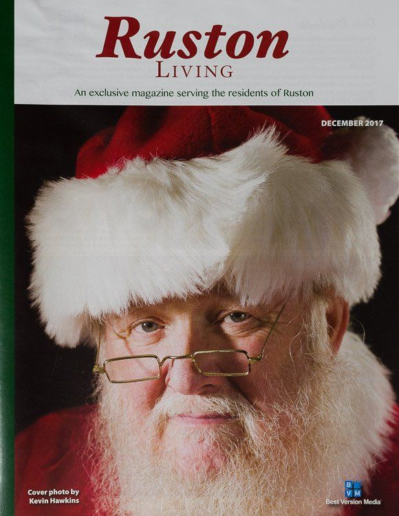 A man with a santa hat and glasses is on the cover of a ruston living magazine
