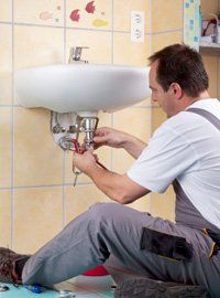 Plumber working at home