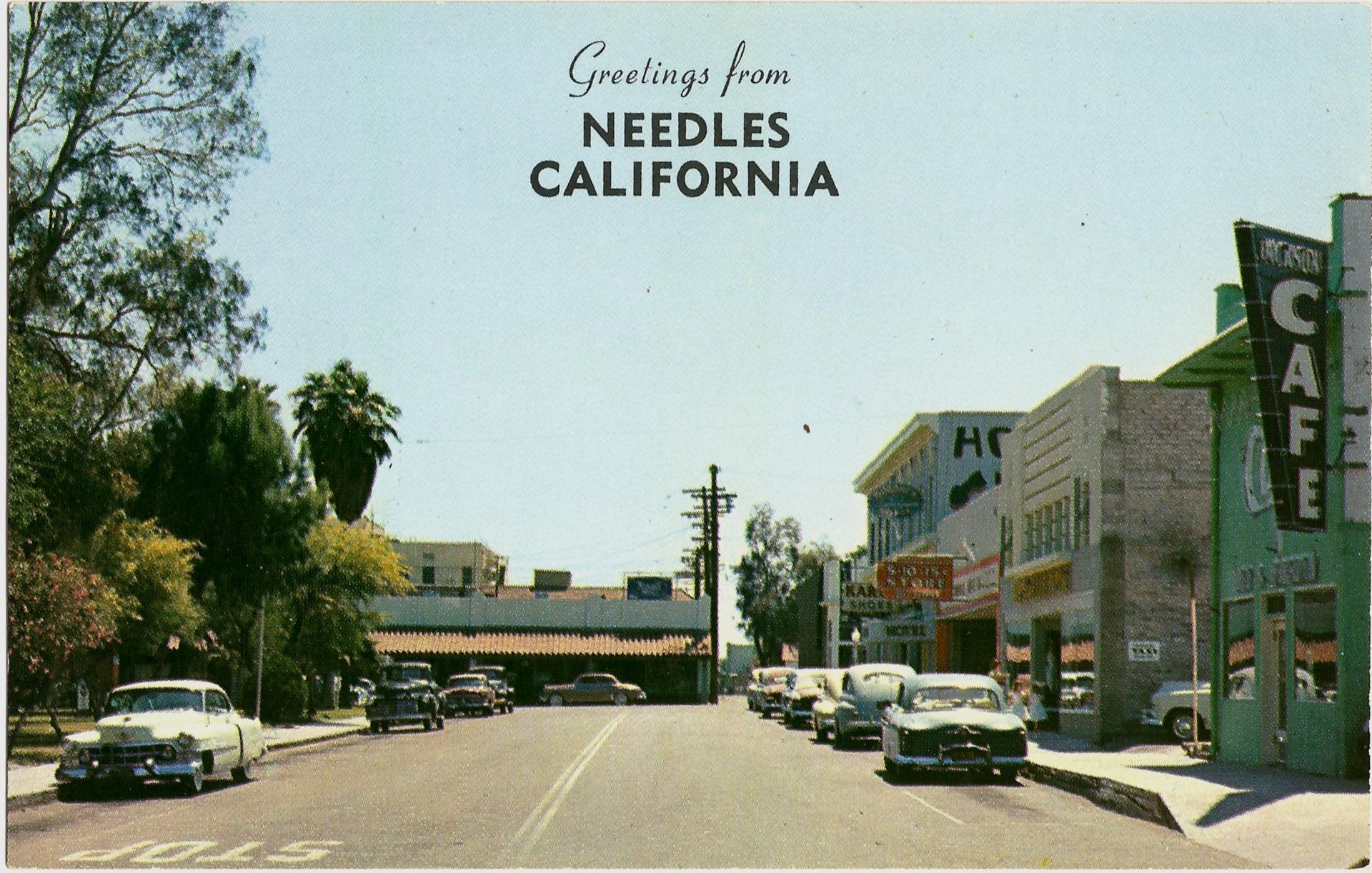 A postcard that says greetings from needles california
