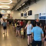 A group of people are standing in a line in a building.