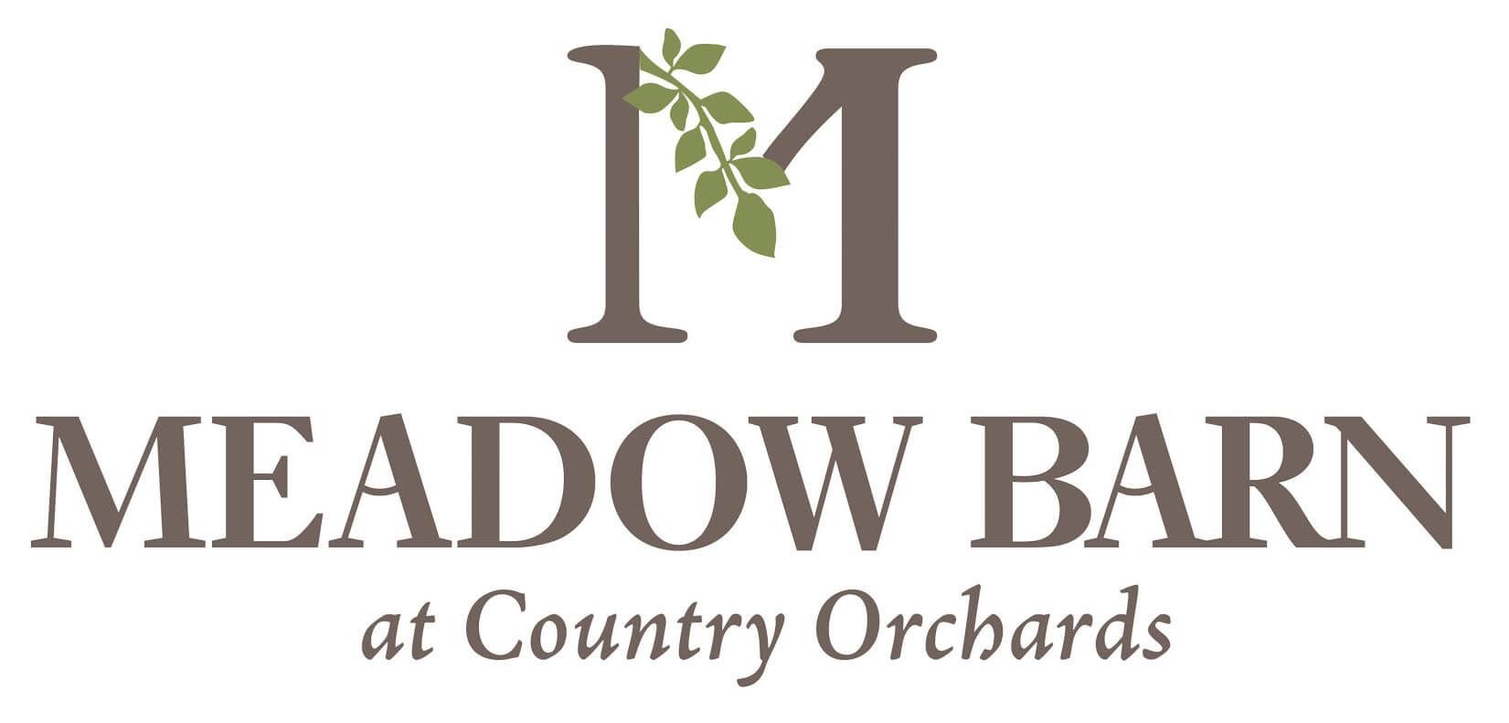 A logo for meadow barn at country orchards